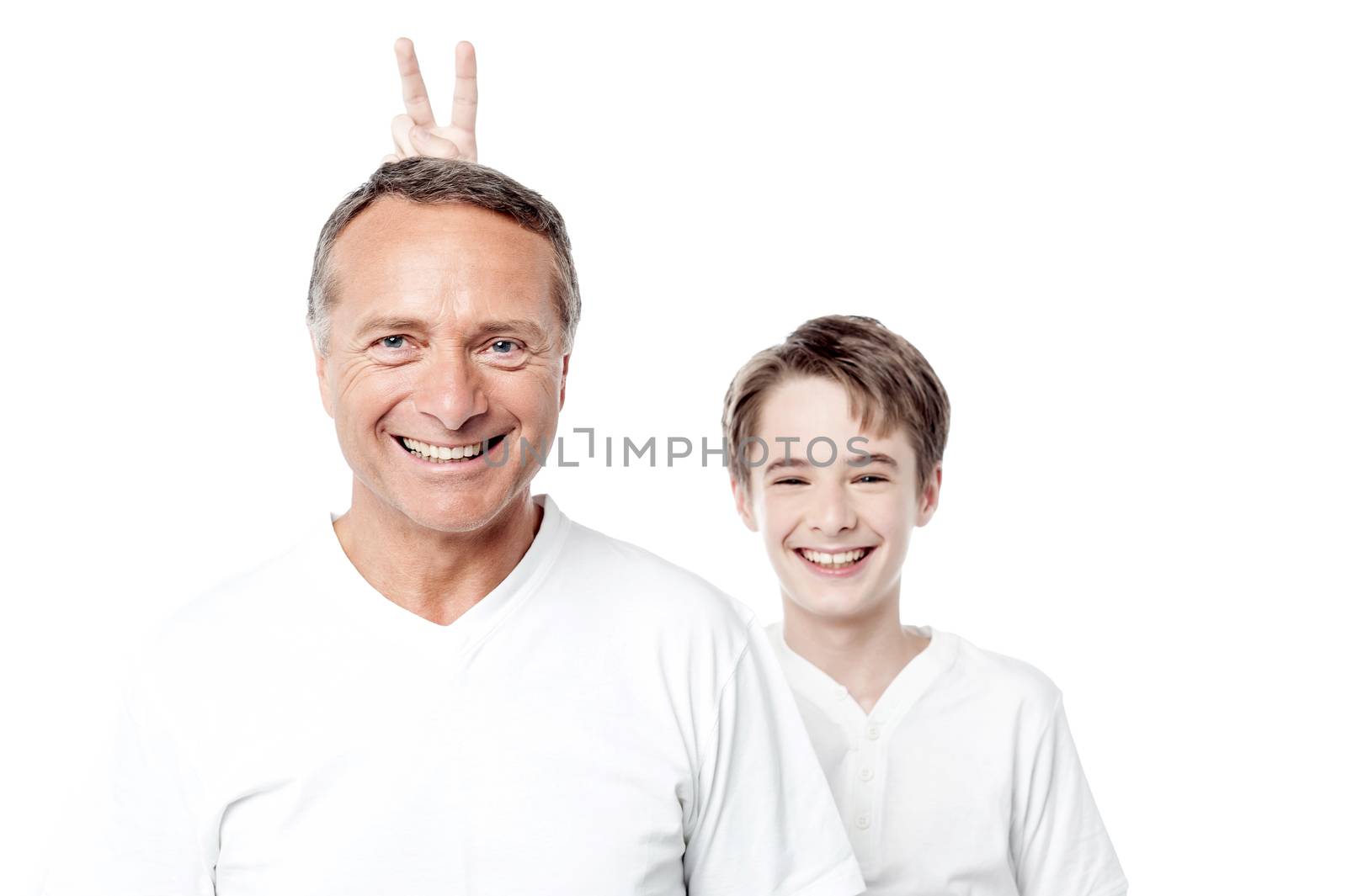 Happy playful father and son posing to the camera