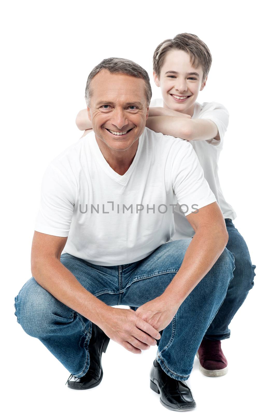 Mature father and son posing together