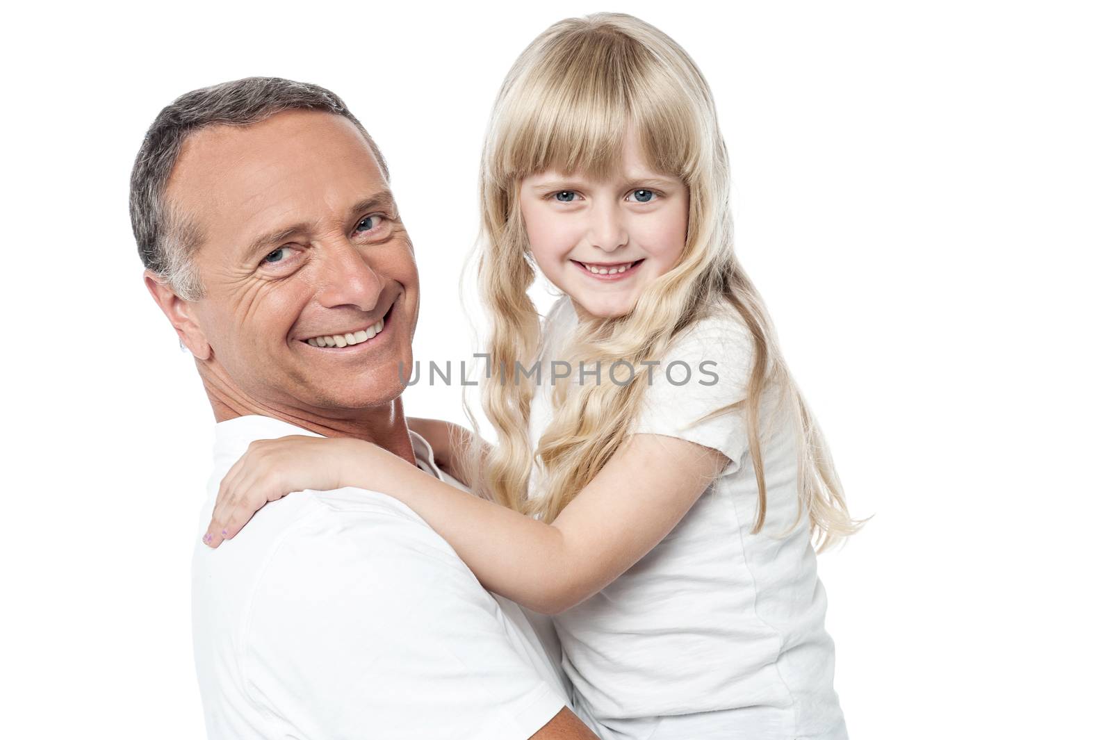 Father holds the little daughter in his arms