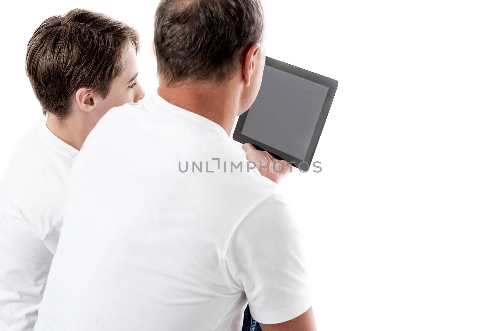 Father and son working with tablet pc against white background