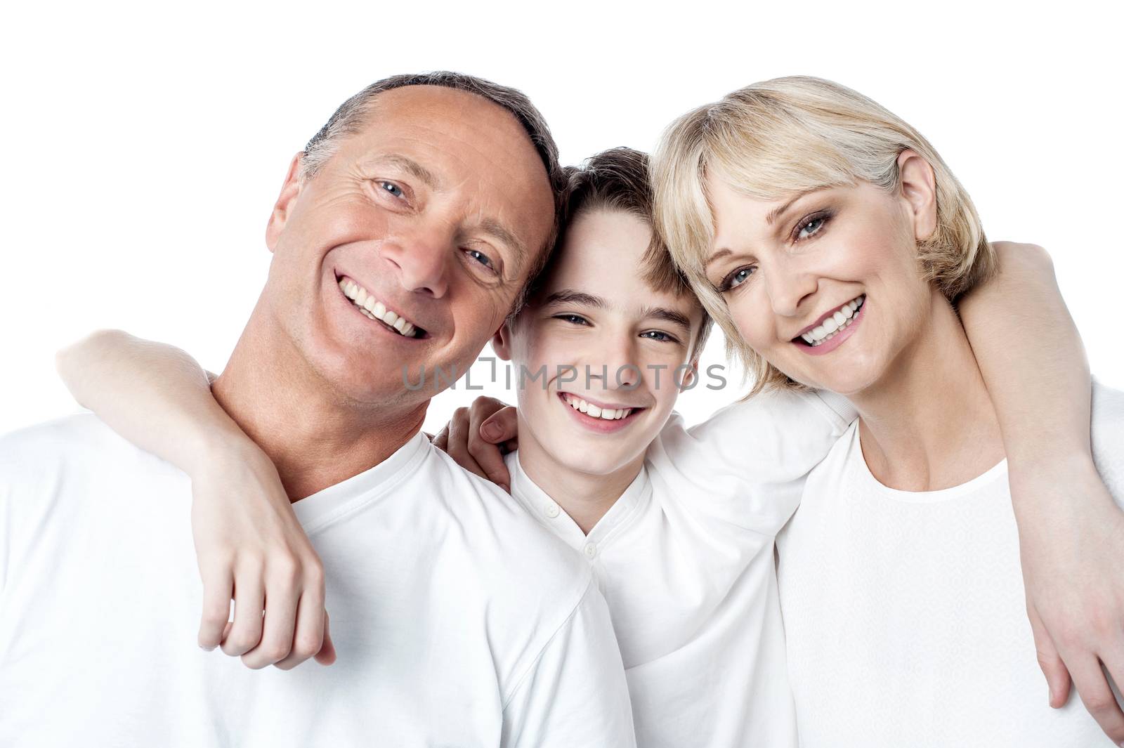 Happy smiling couple with their son posing at studio