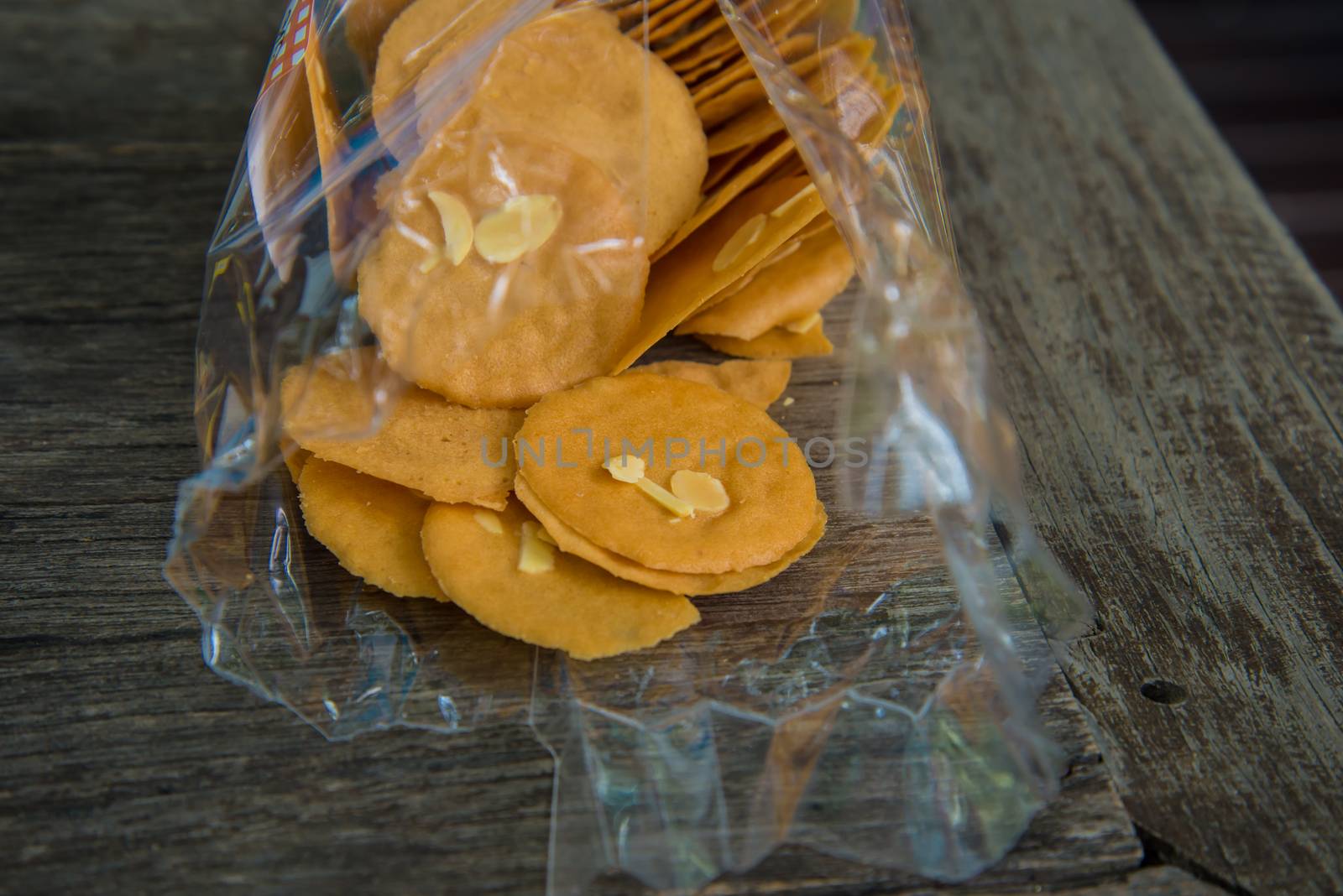 Snack on the wooden table in the garden of coffee shop.