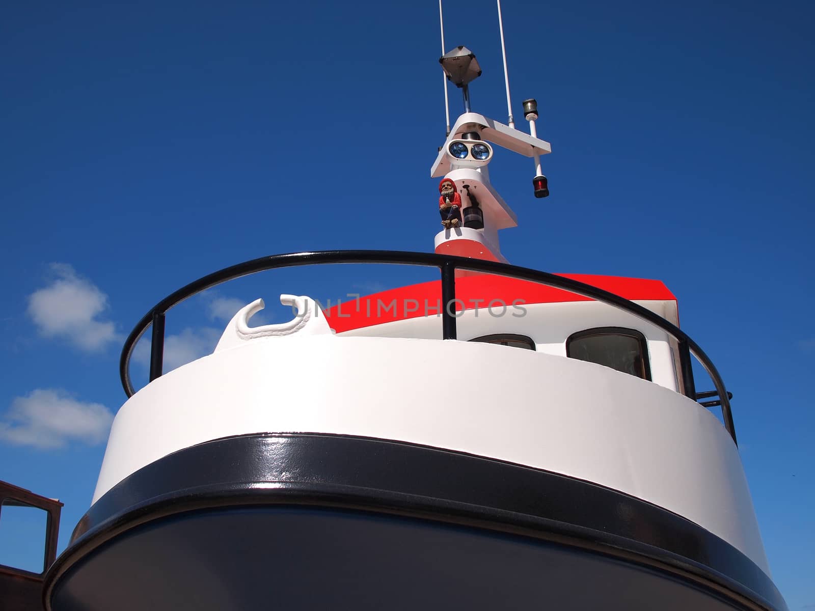 Prow of a small ferry boat with clear blue sky background  