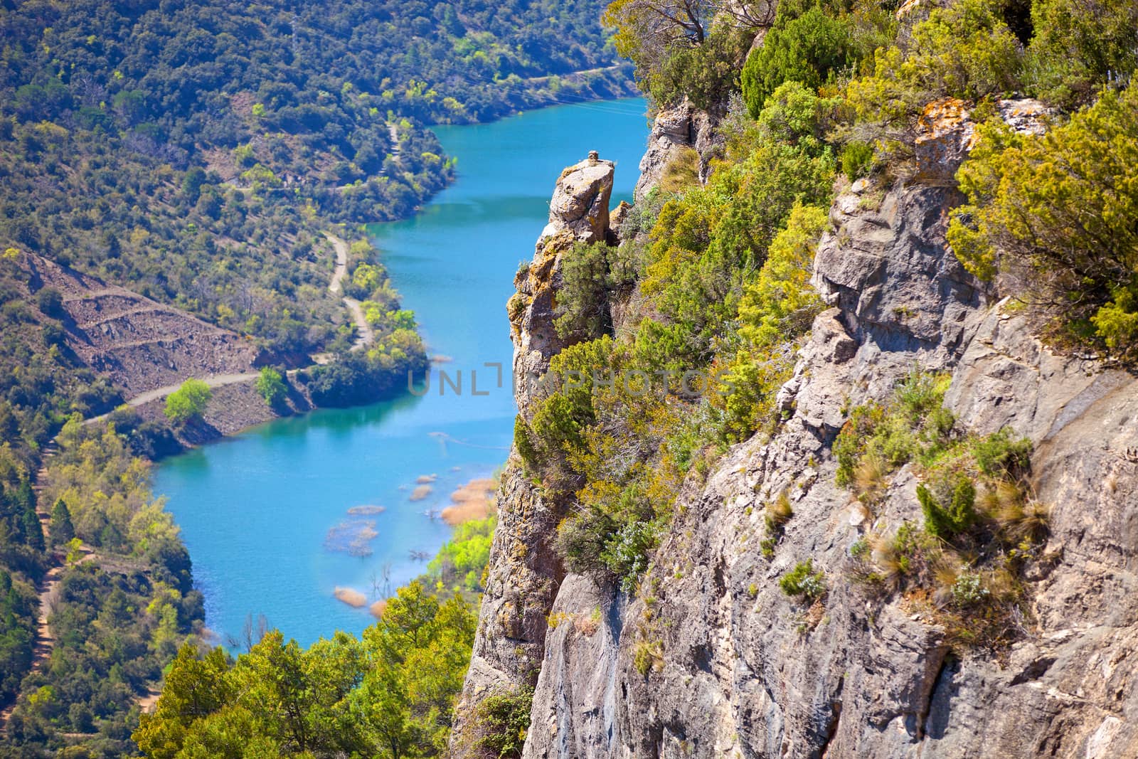 View of cliff and river flowing below near Siurana by photobac