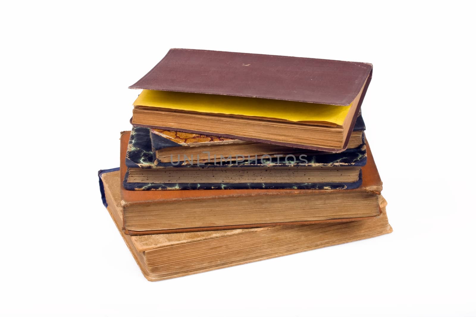 Old books on a pile on a white background by aniad