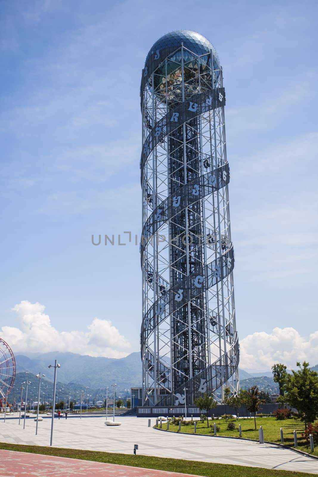 Alphabet Tower in Batumi, Georgia against blue sky