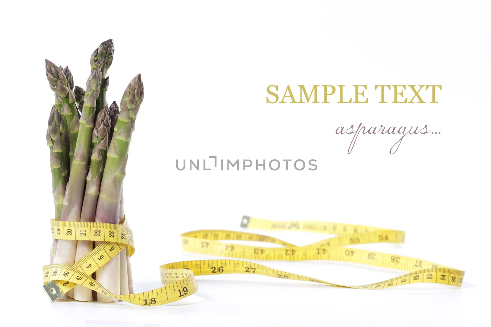 Raw asparagus and measuring type isolated on a white background