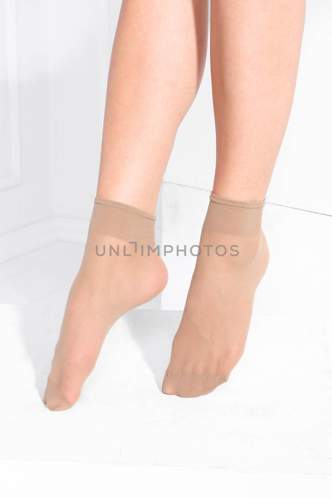 Female legs in tights, stockings, socks.