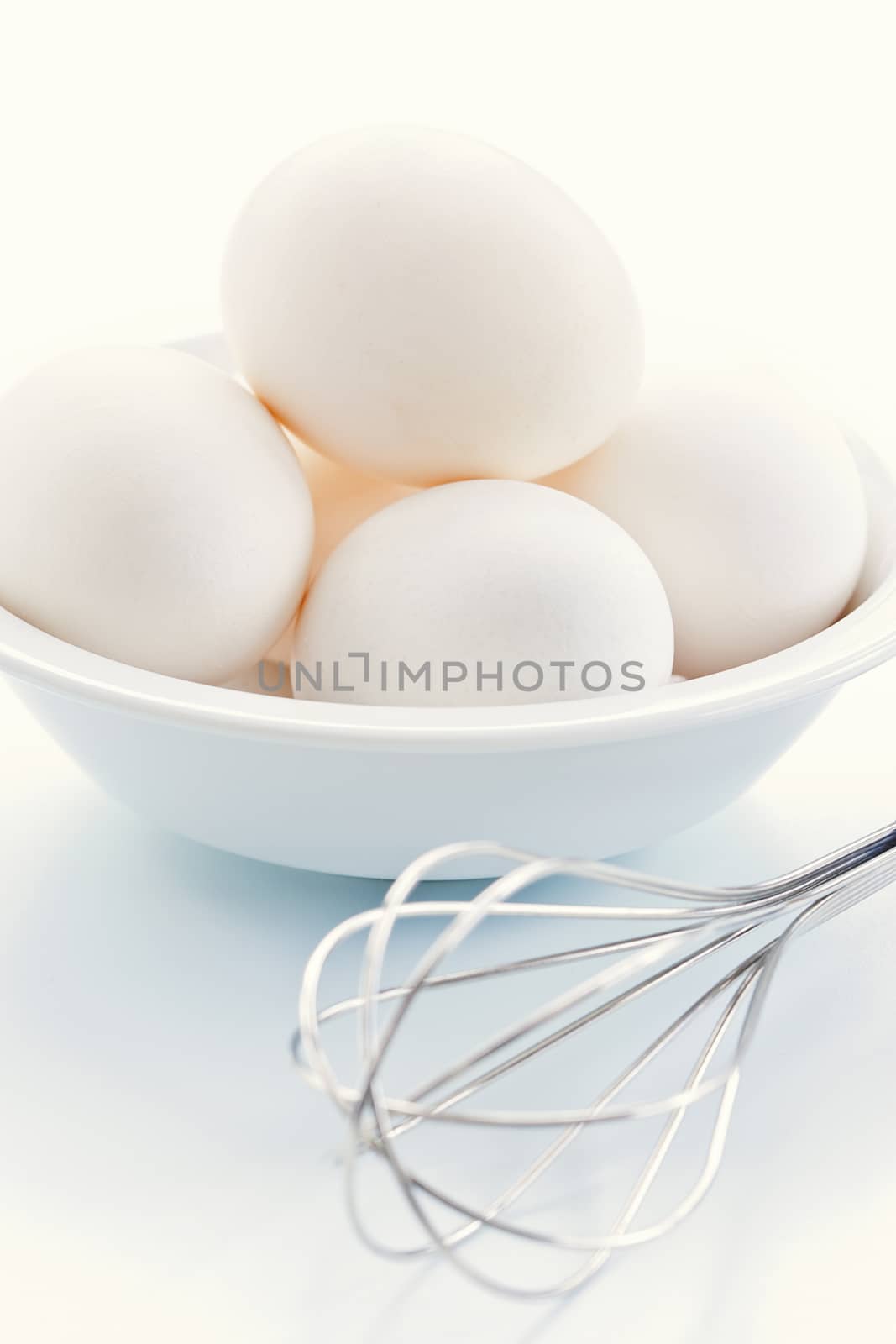 Fresh eggs with whisk for baking