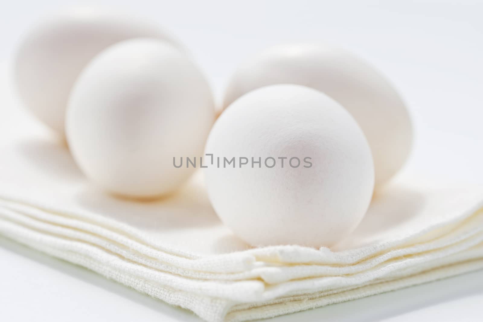 Fresh eggs on white background