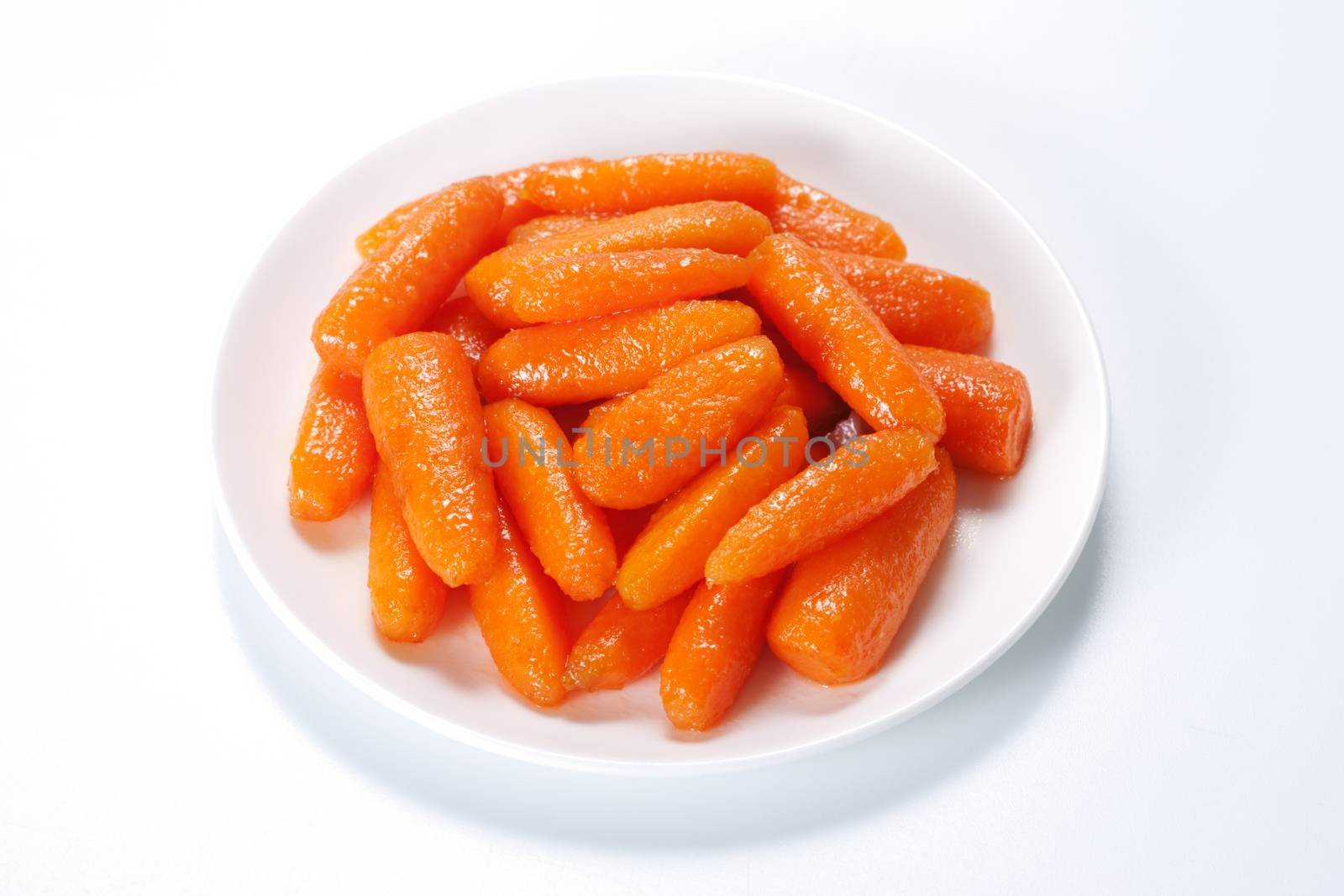 Honey glazed baby carrots in plate