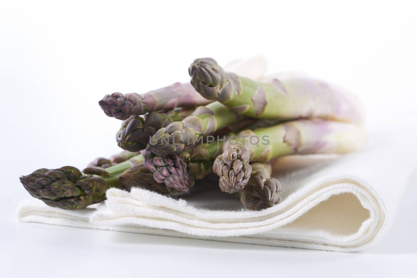 Raw asparagus on a white background 