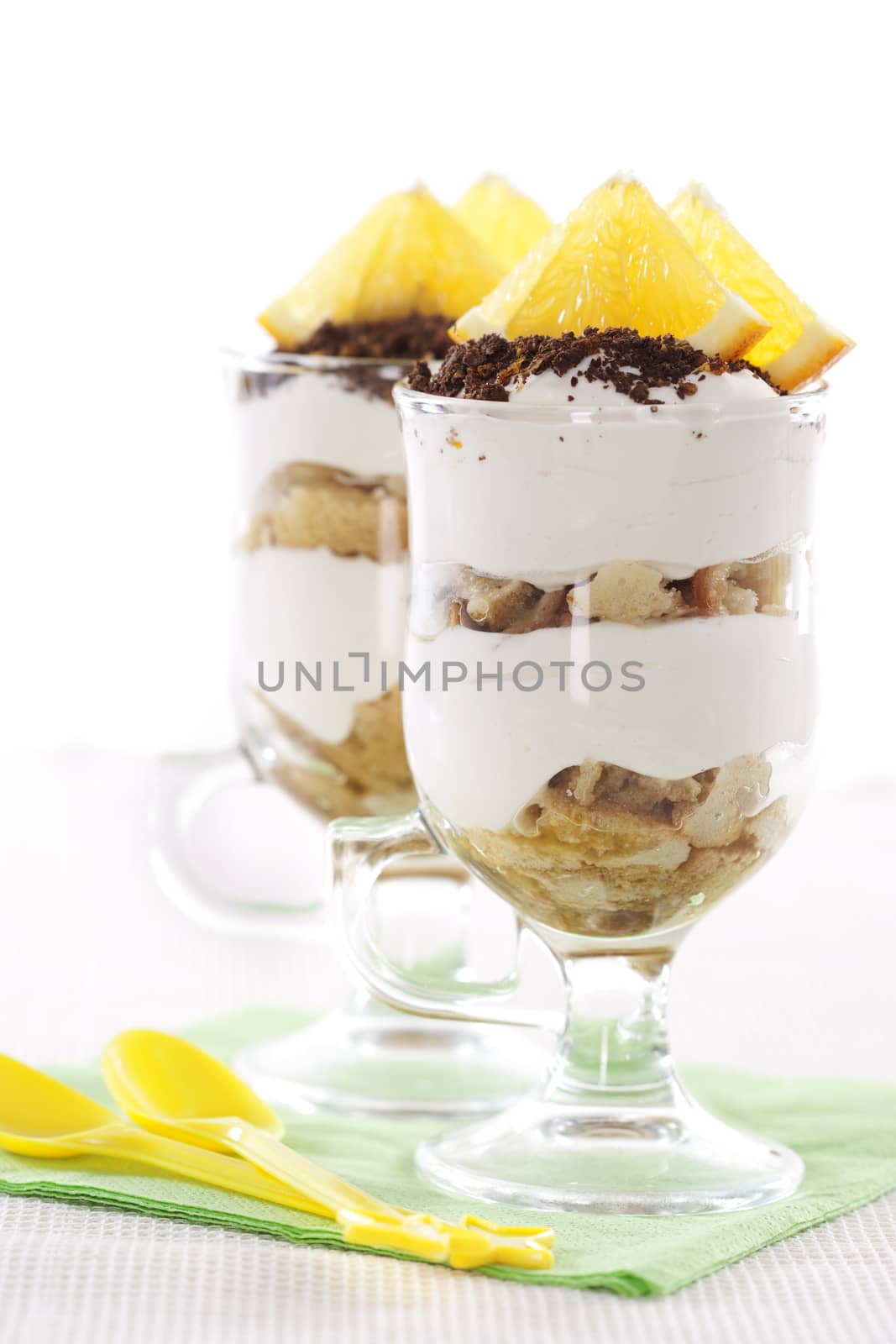 Tasty tiramisu dessert in two glasses