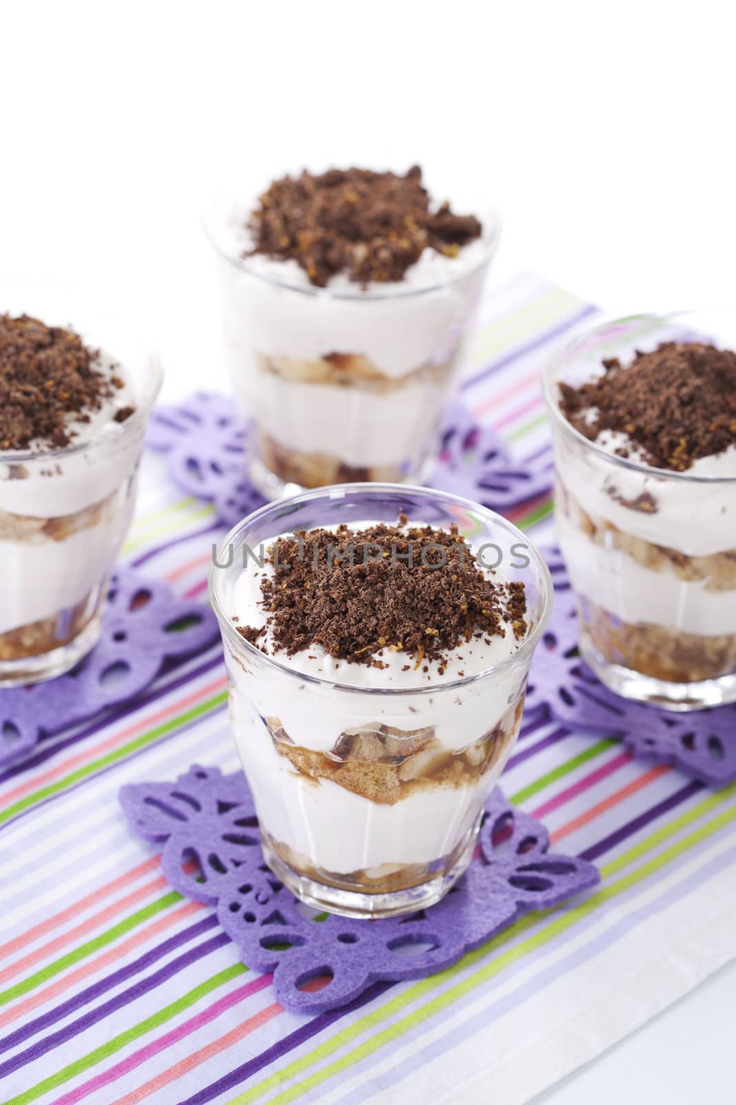 Tasty tiramisu dessert in glasses