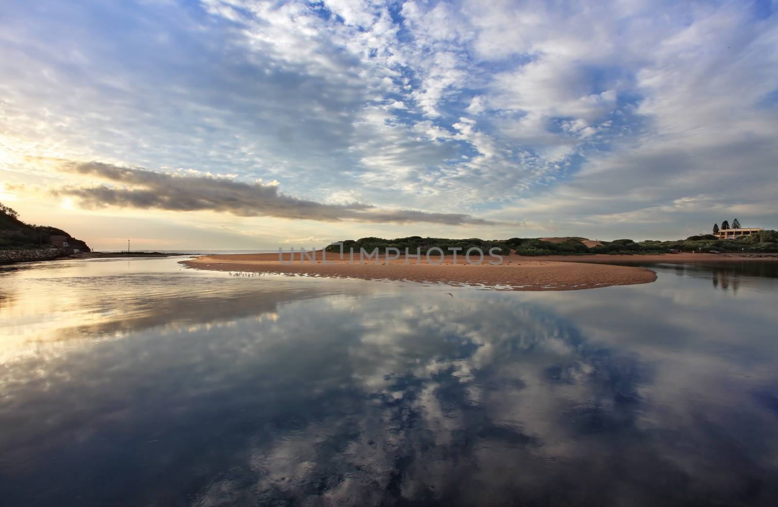 Capturing the cloud reflections in the water at Narrabeen Lakes entrance on the Northern beaches, Sydney.
