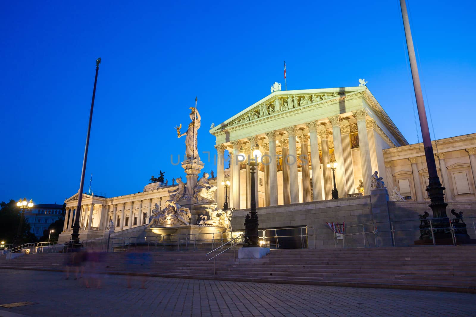 Austrian Parliament Building and The Athena Fountain at night.