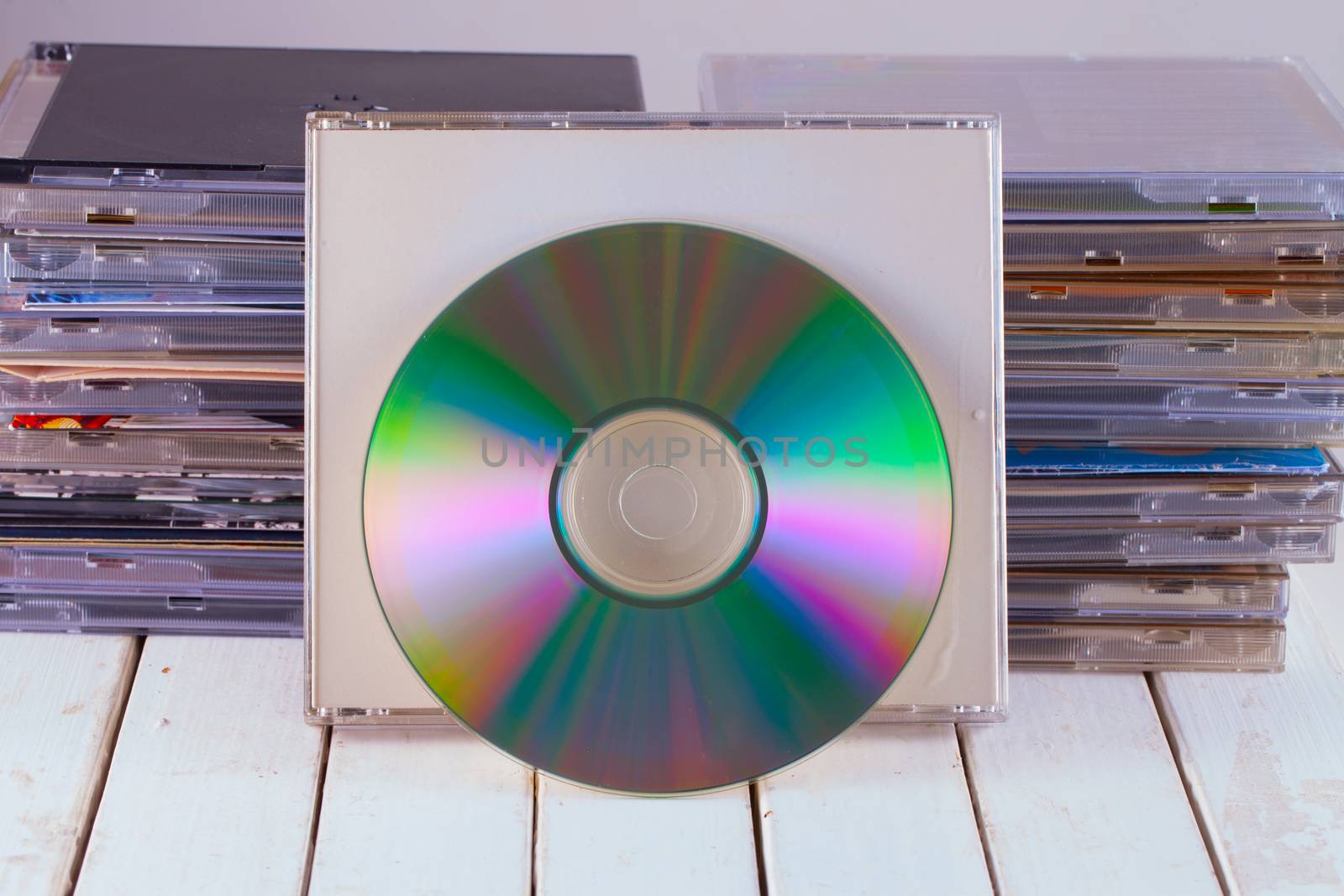 Cd leaning on a stack of cds