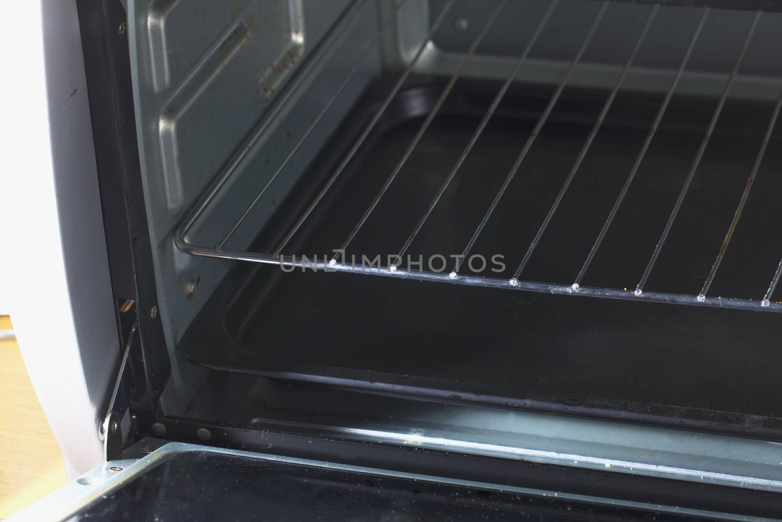 Open electric oven, empty, in a kitchen