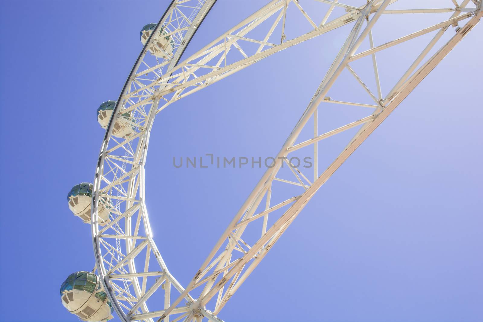 Ferris wheel against the blue sky by faa069913827