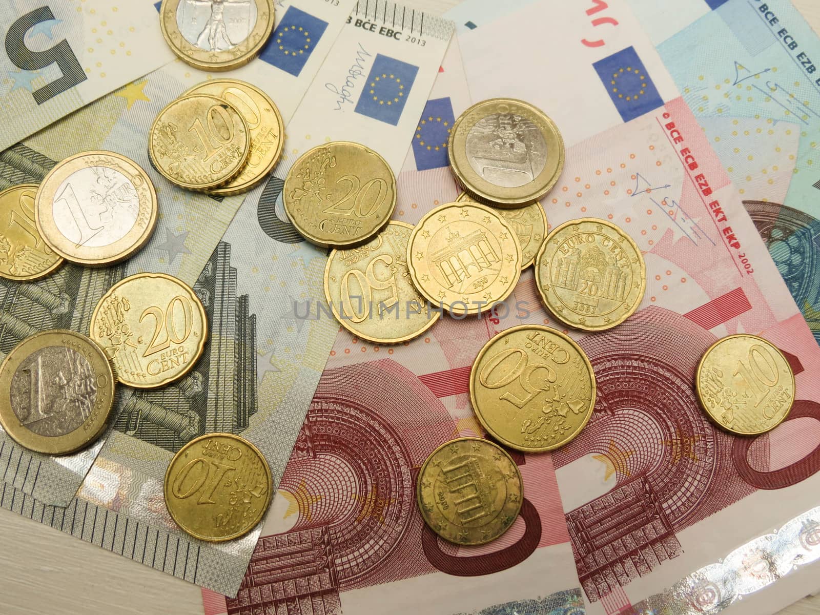 Euro banknotes and coins by paolo77