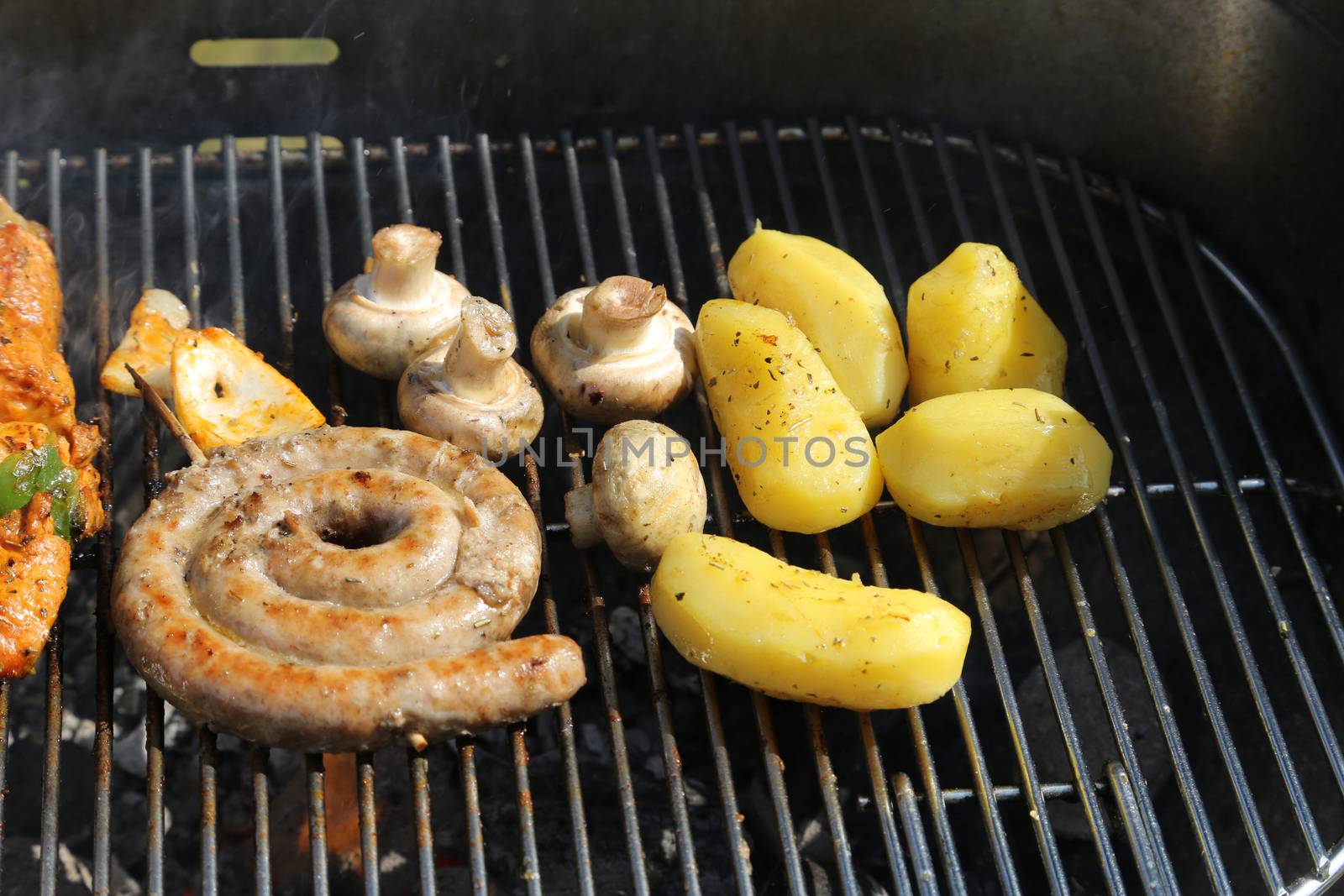 Cooking a Meat on a Barbecue outside in the garden