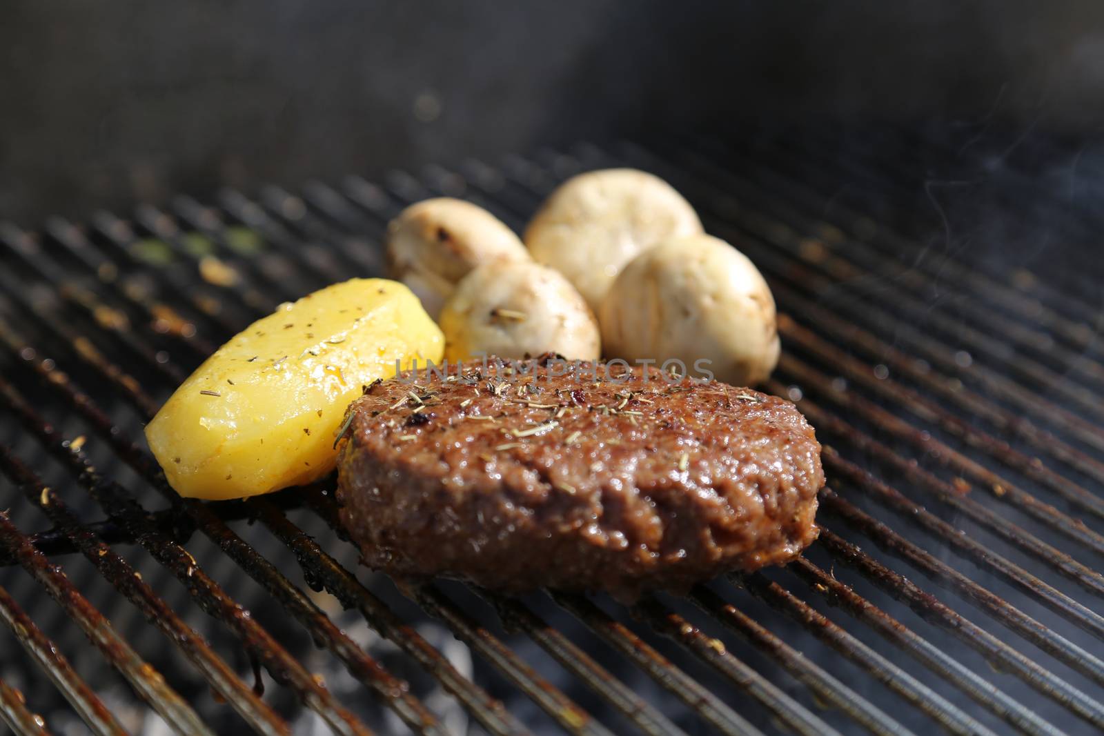 Cooking a Meat on a Barbecue outside in the garden