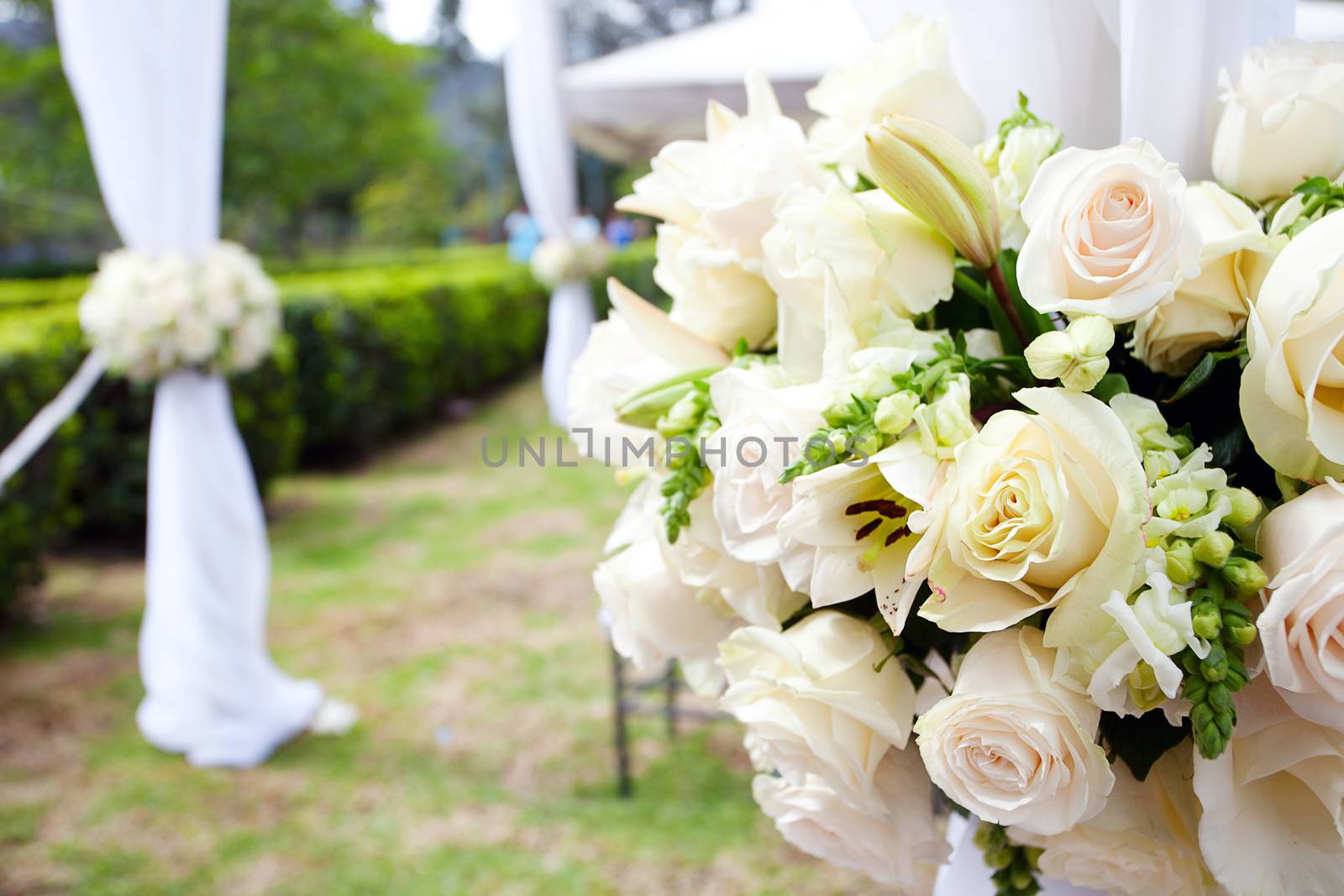 wedding marquee with bouquets of roses by jannyjus