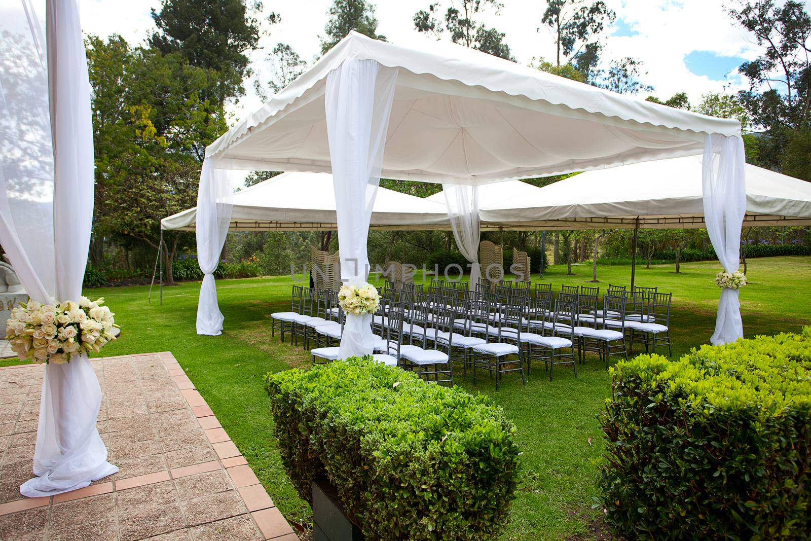 wedding marquee with bouquets of roses