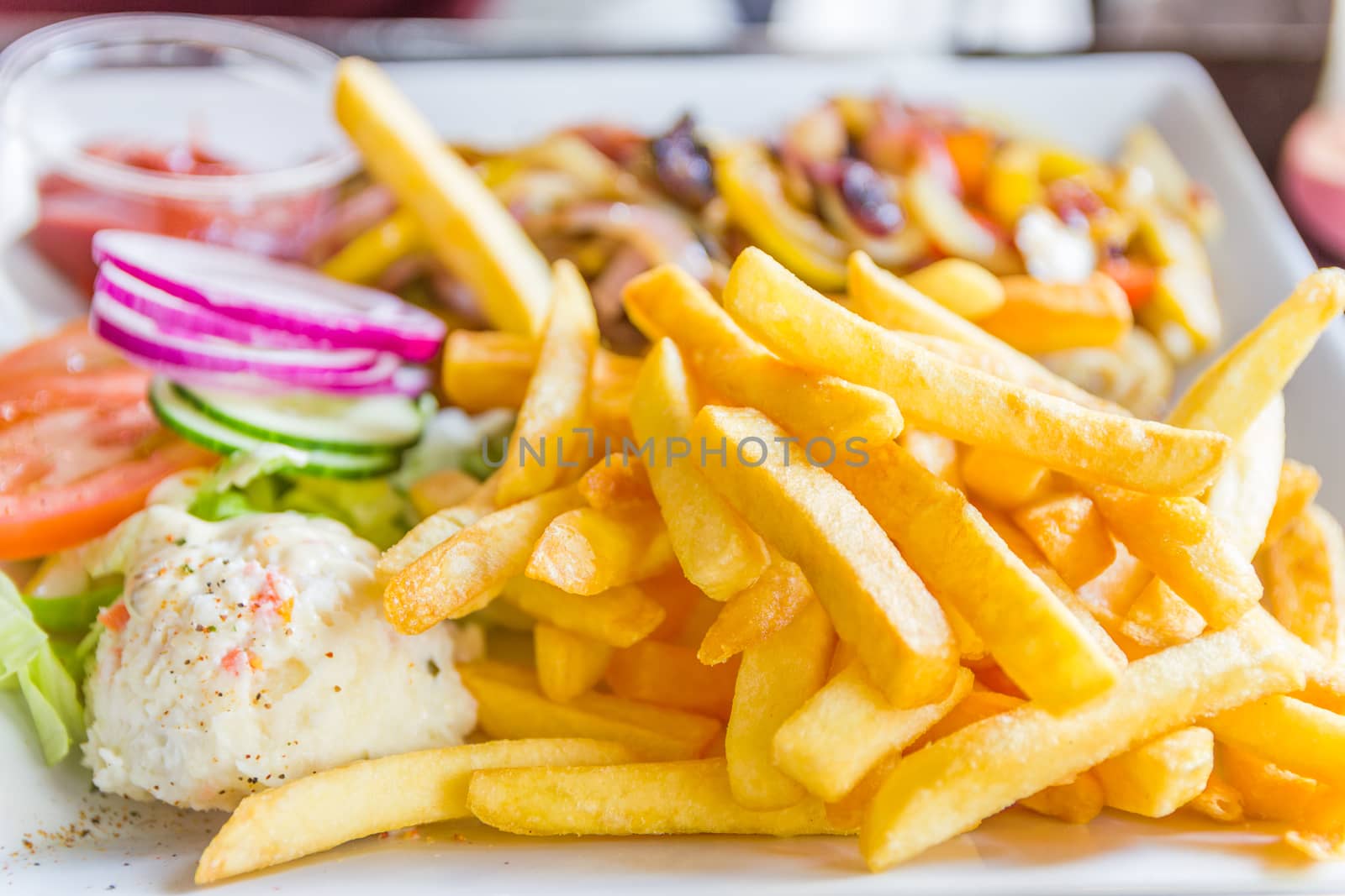 Plate full of French fries by gianliguori