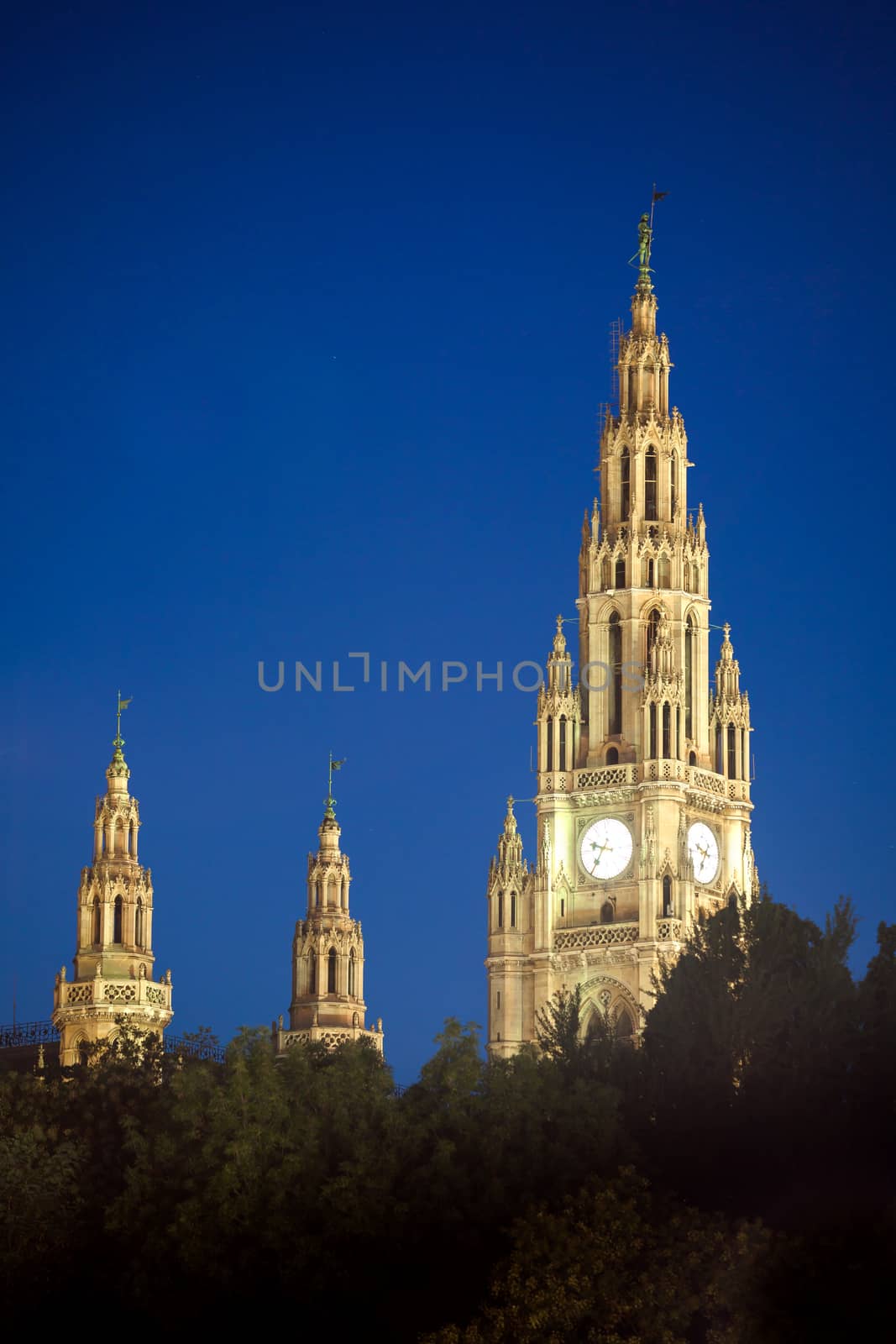 VIENNA, AUSTRIA - AUGUST 4, 2013: Gothic building tower of Vienna city hall, Rathause, at night, Austria