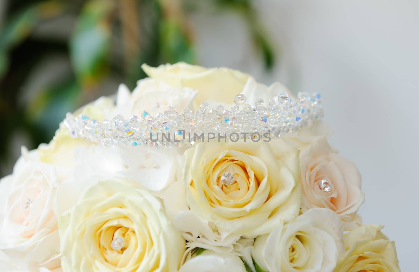 Brides bunch of yellow roses with closeup of tiara showing detail