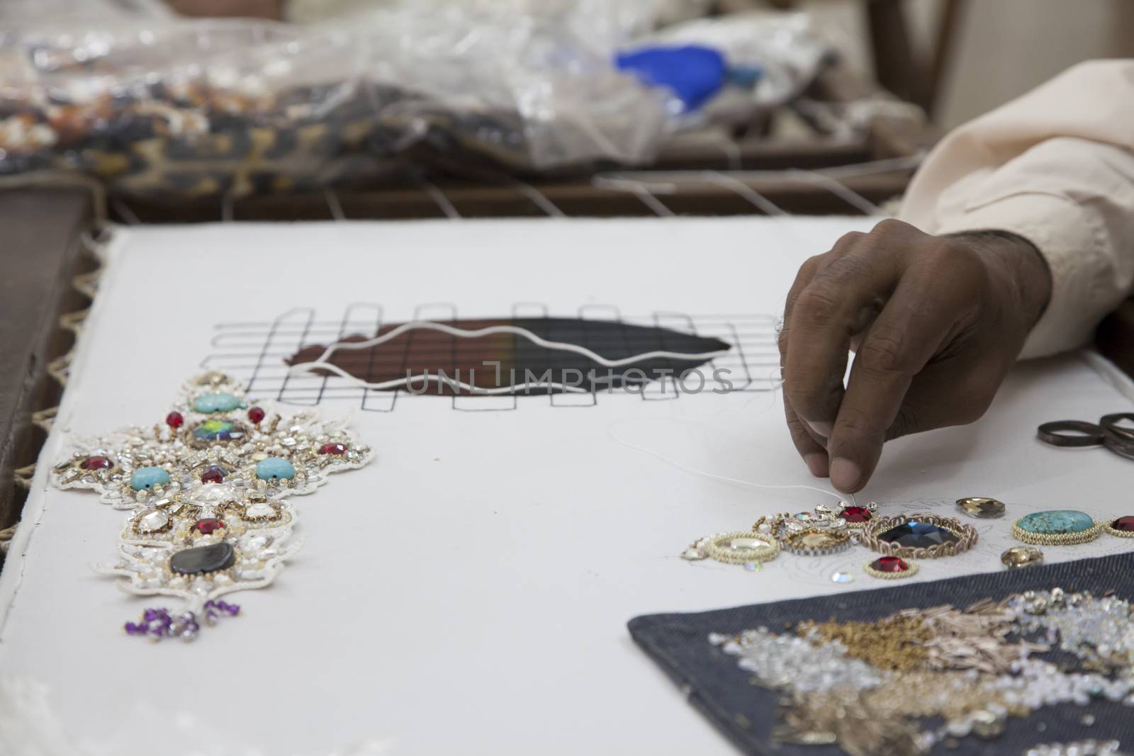Tailor sewing embroidery  by haiderazim