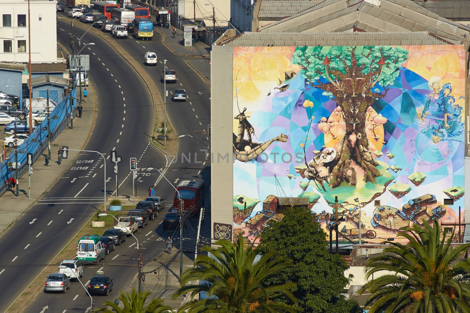Large colourful murals decorating building in the old harbour area of Valparaiso in Chile