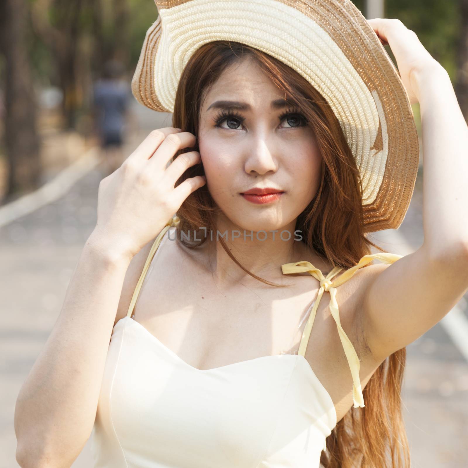 Portrait Asian woman wearing hat by a454