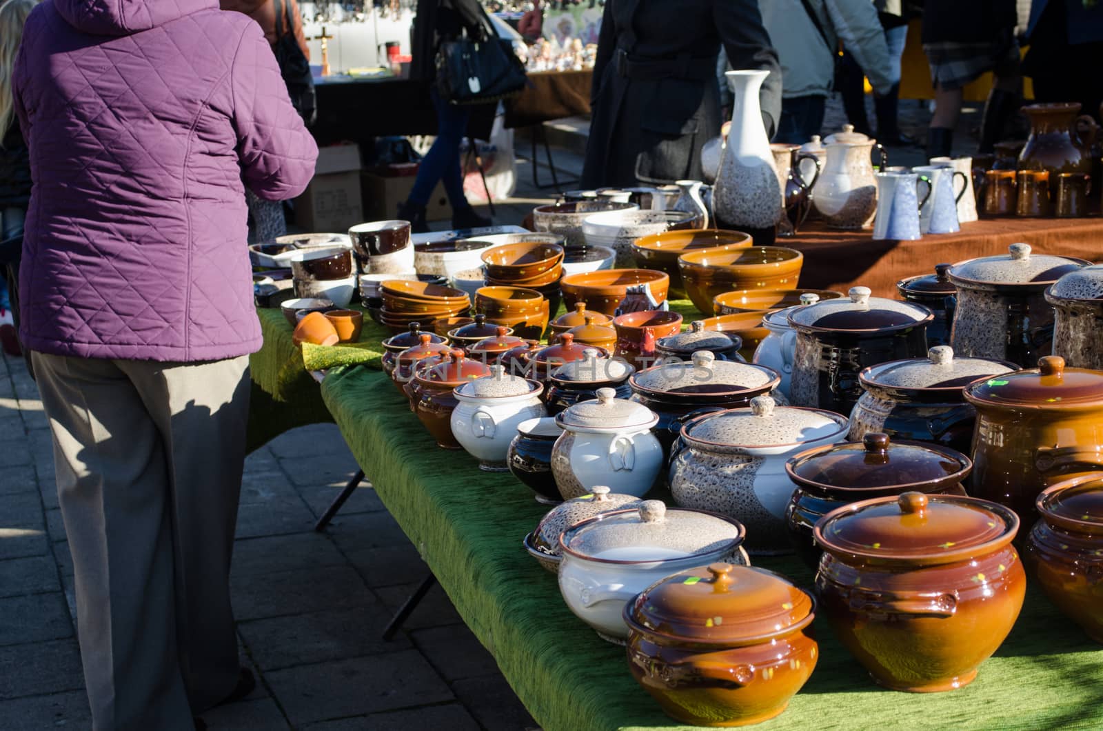 handmade craft clay varnish pots with lids at rural fair