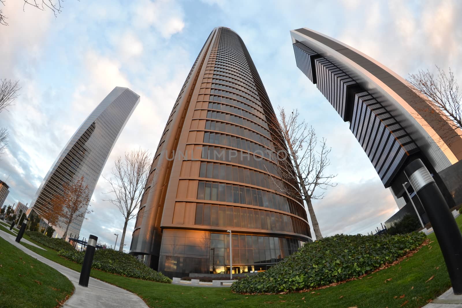 three towers through a fisheye lens, at twilight, Madrid, Spain by ncuisinier