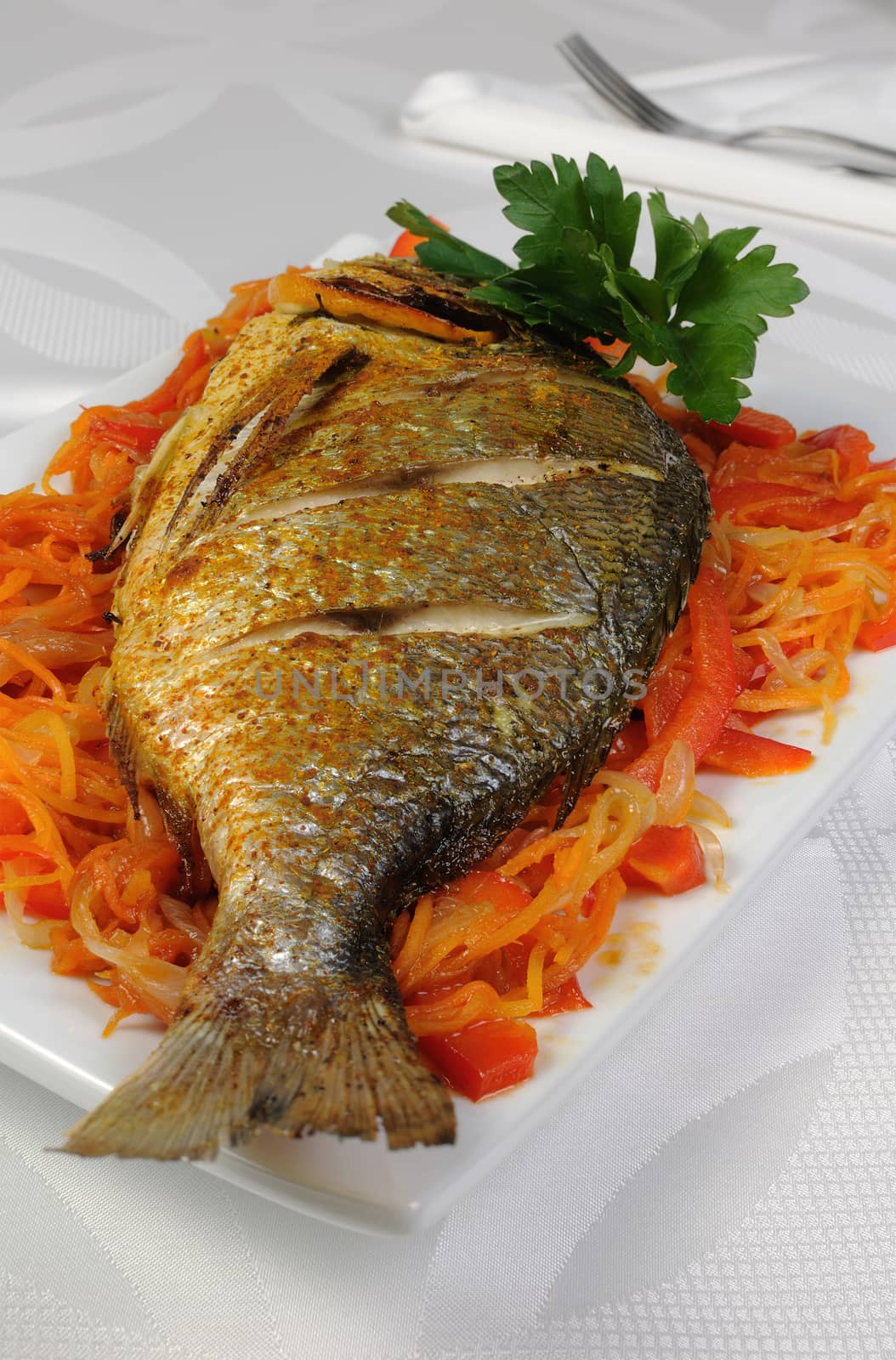 Fried Fish (Dorado) on a bed of vegetables