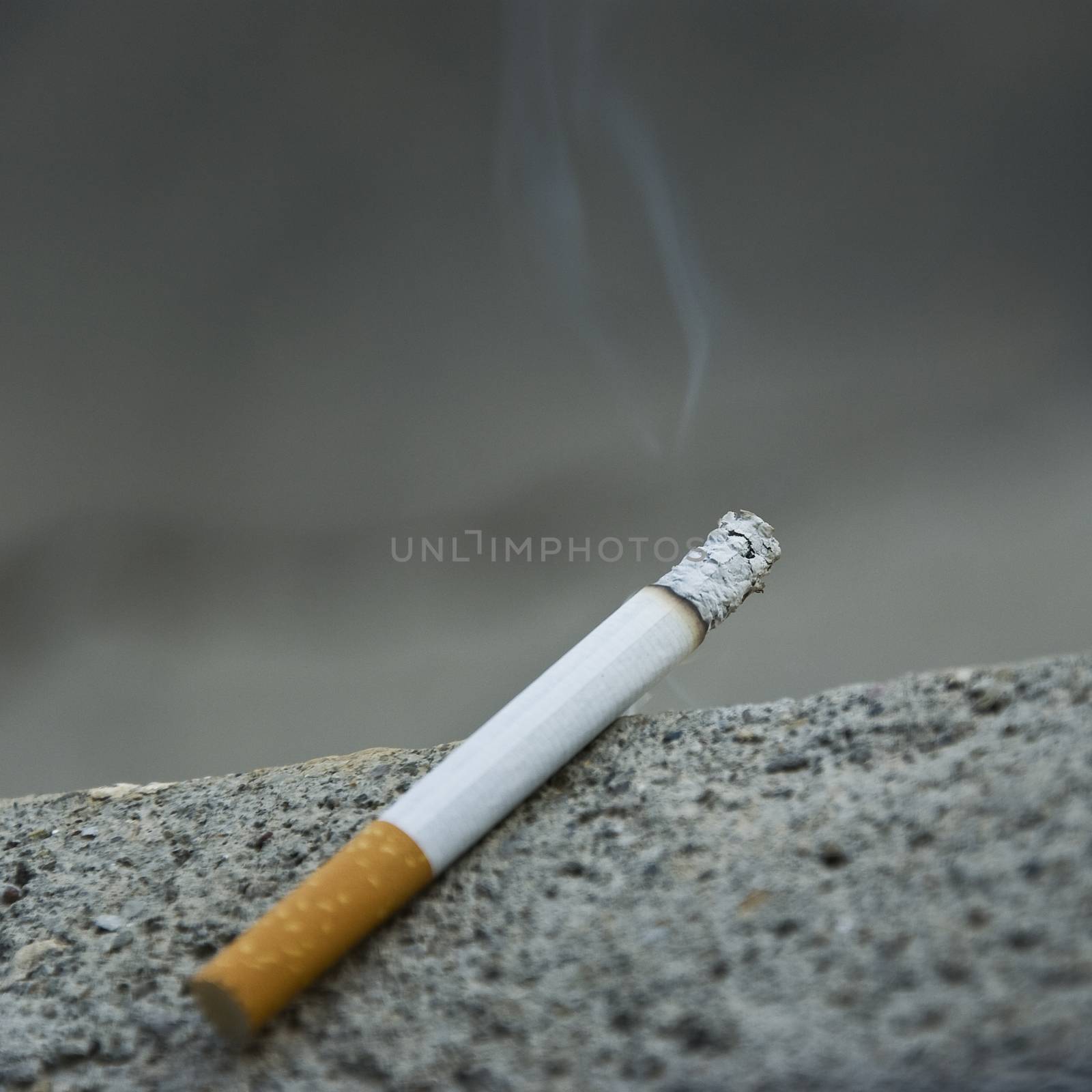 cigarette closeup by NeydtStock