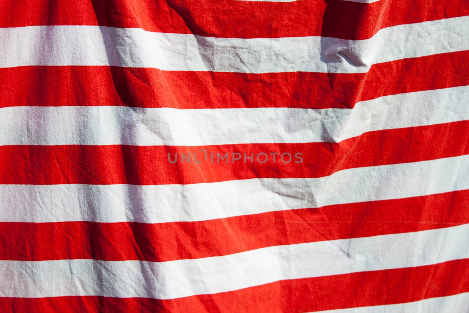 Red and white stripes background in the wind