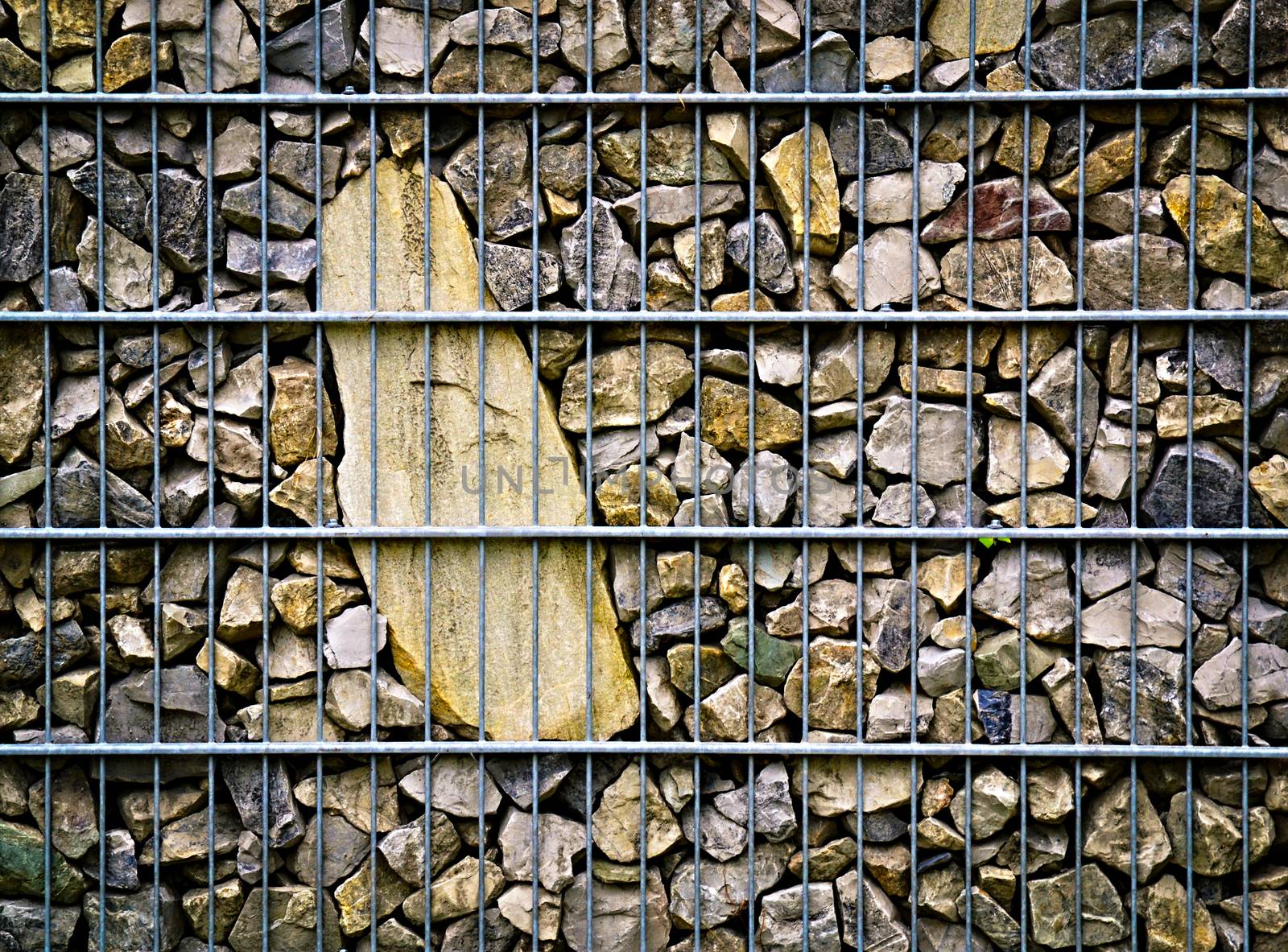 background or texture imprisoned in stone steel mesh