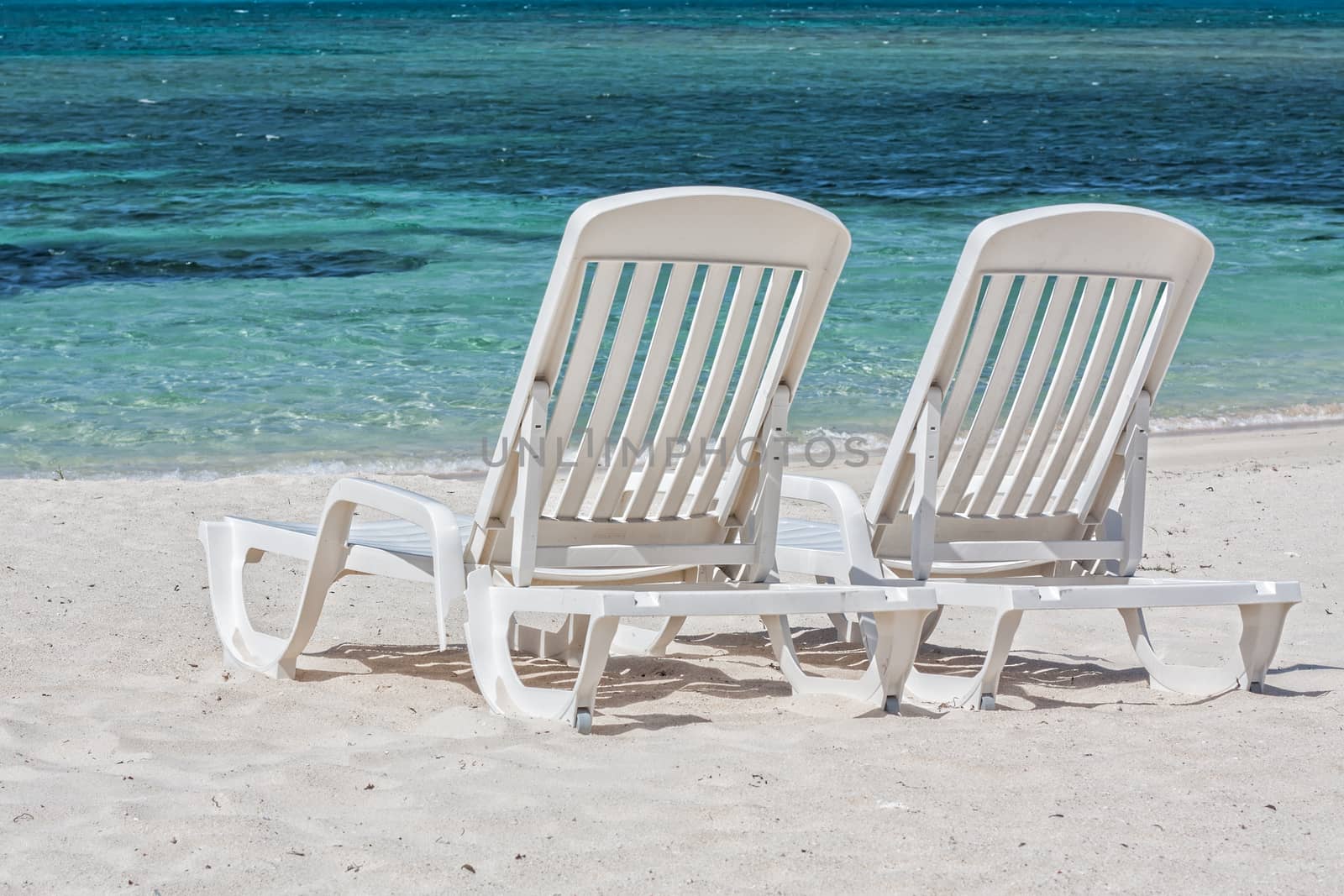 Sun loungers facing the Caribbean Sea by Brigida_Soriano