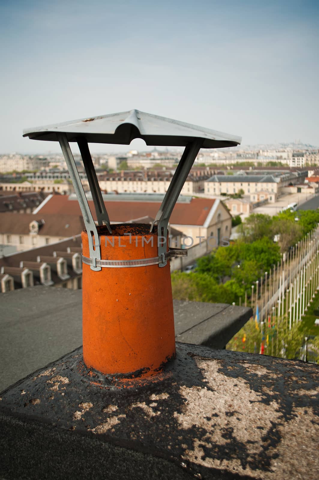 Chimneys on the roofs of Paris by NeydtStock