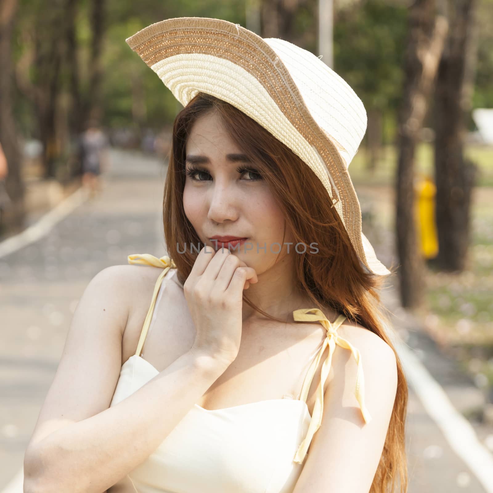 Portrait Asian woman wearing hat Within the park