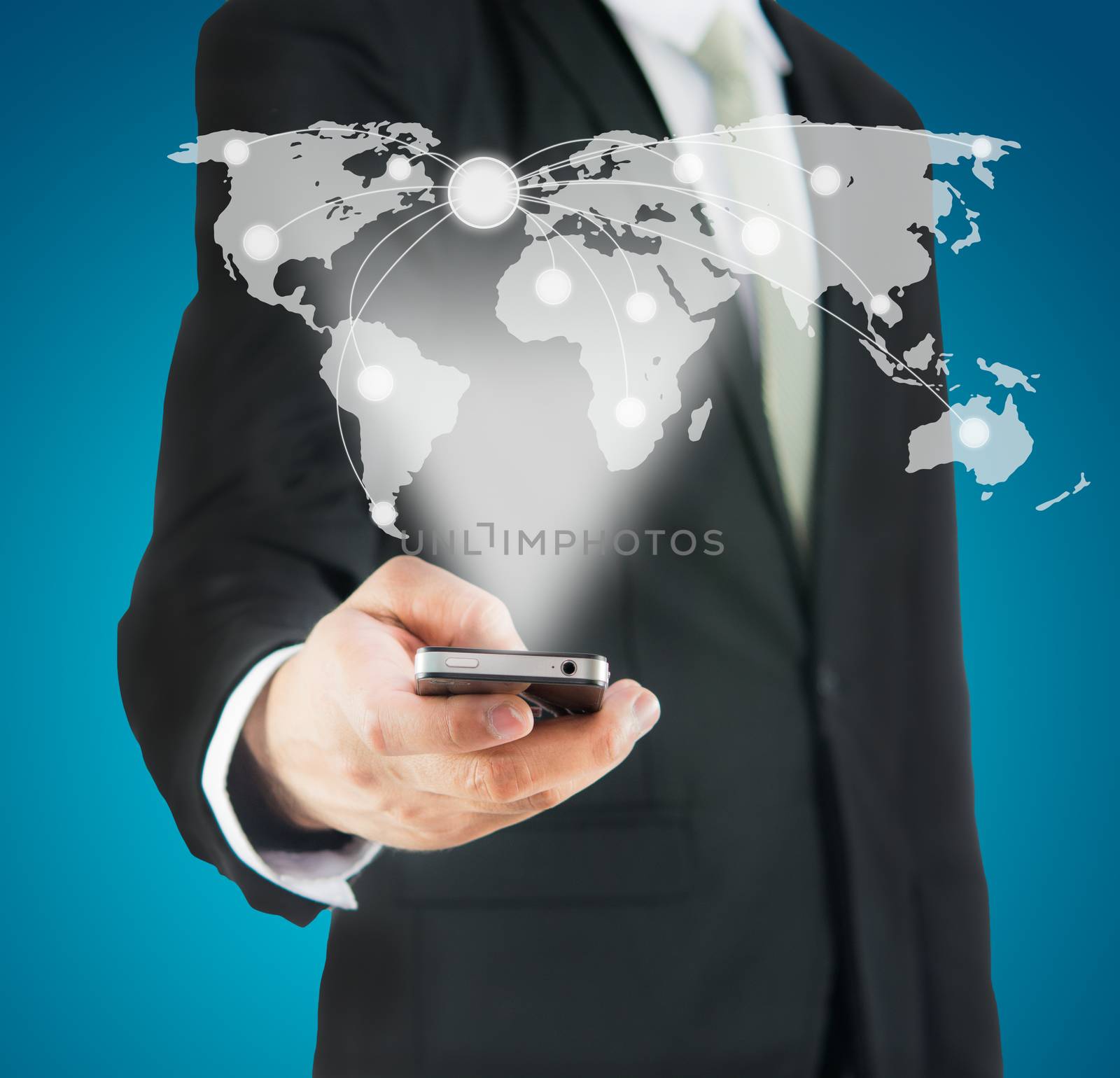 Businessman standing posture hand hold mobile phone Global Marketing isolated on blue background