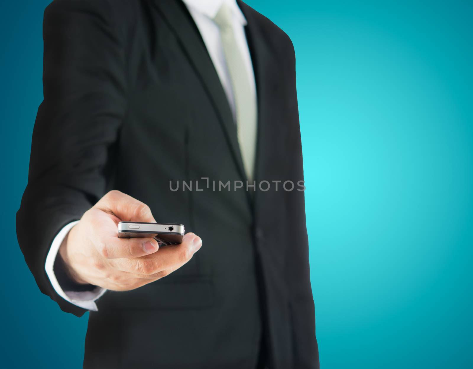 Businessman standing posture hand hold phone isolated on over blue background