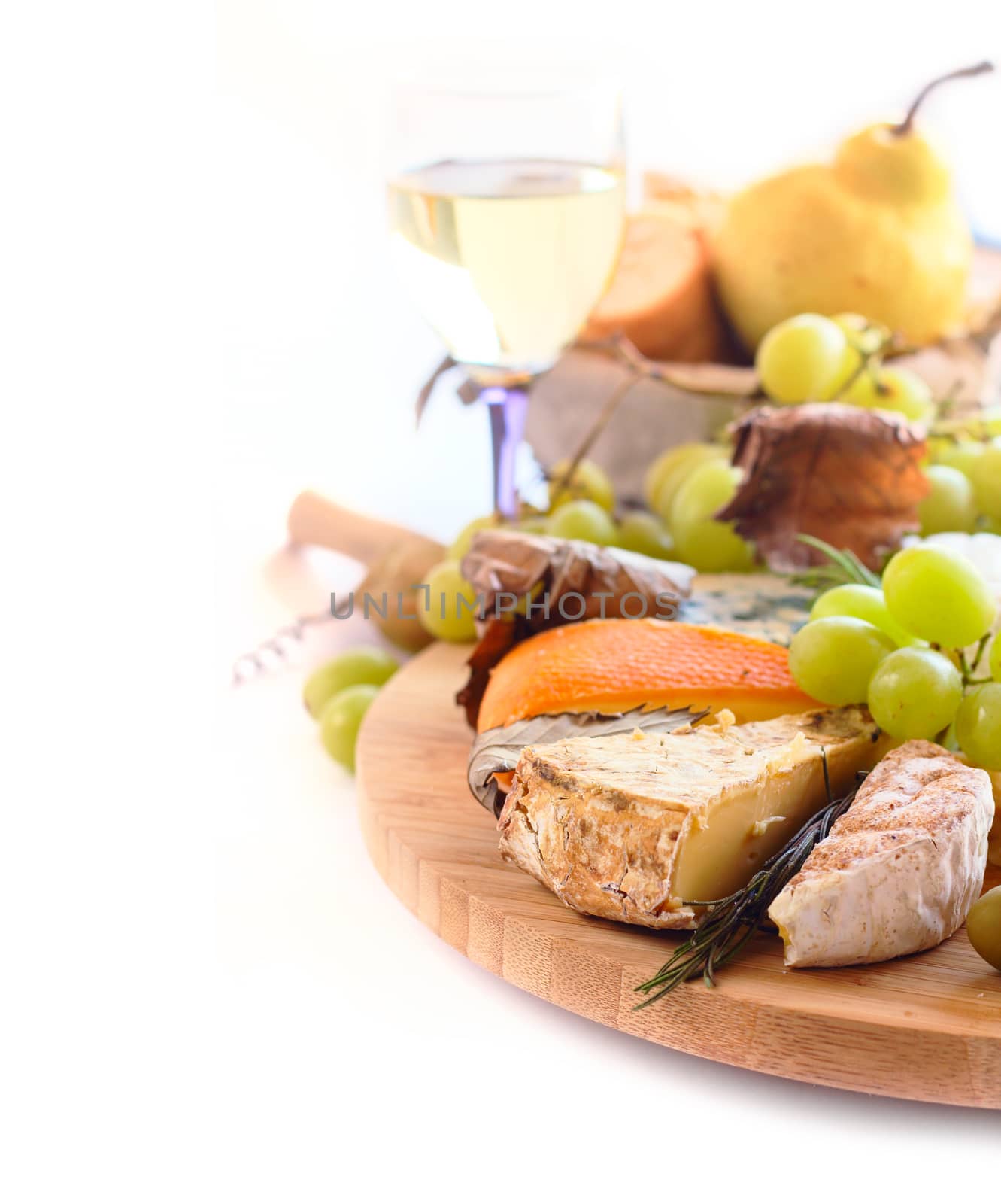 Various types of cheese and wine isolated on white background