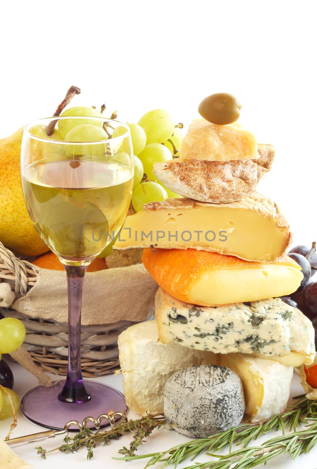 French Cheese, wine and fruits conceptual composition isolated on white