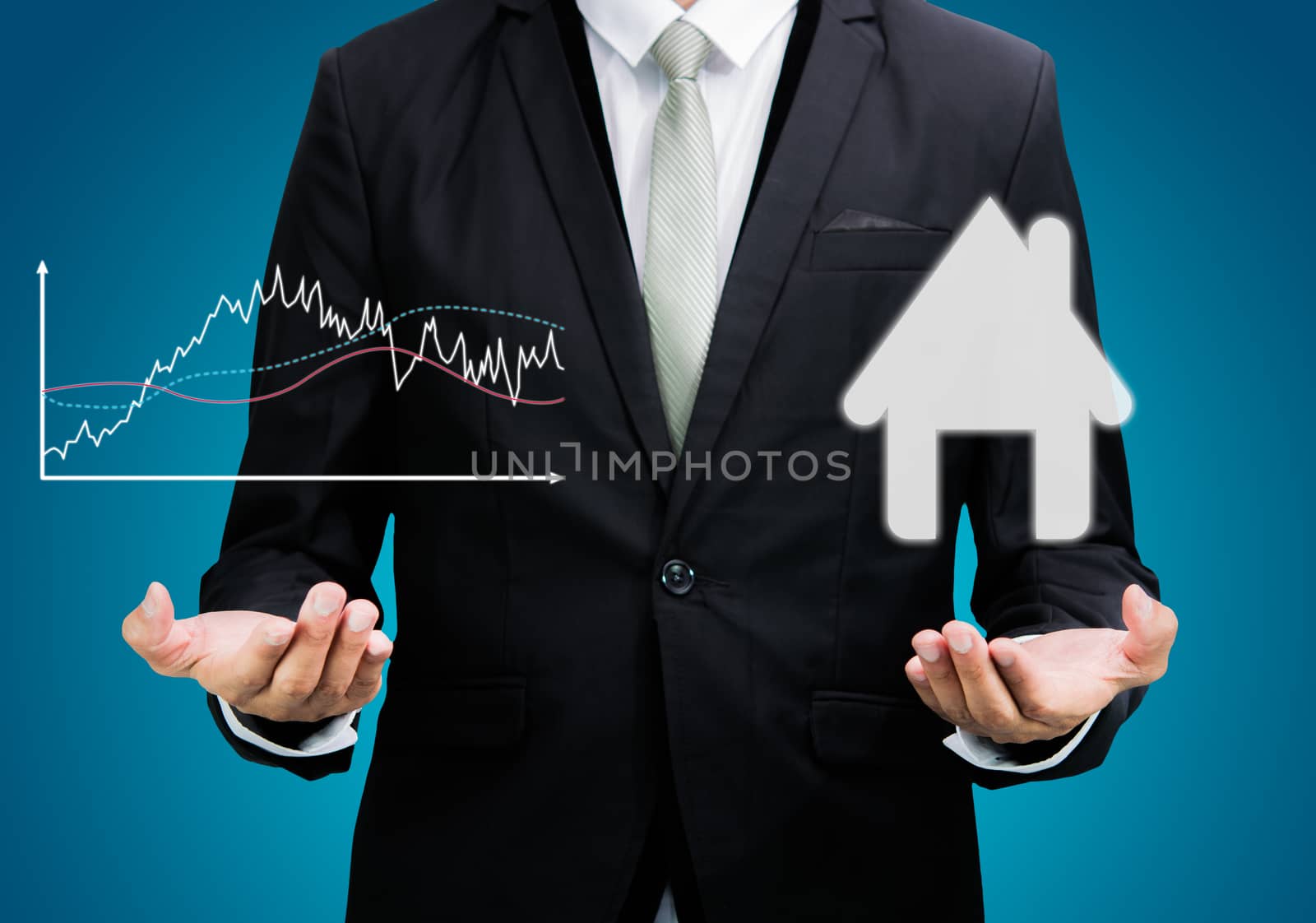 Businessman standing posture hand hold graph and house isolated by Sorapop