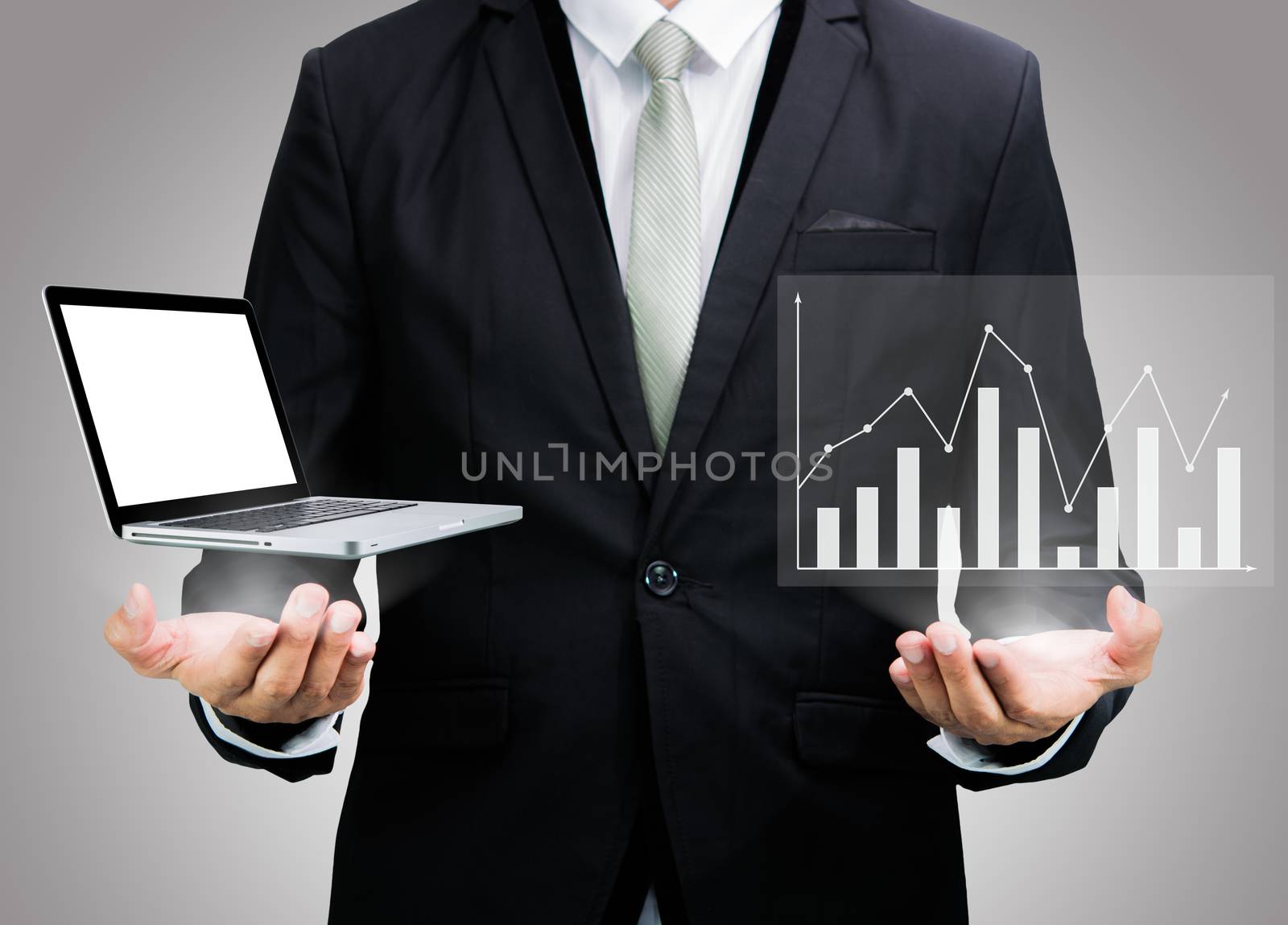 Businessman standing posture hand hold laptop showing graph isolated on over gray background