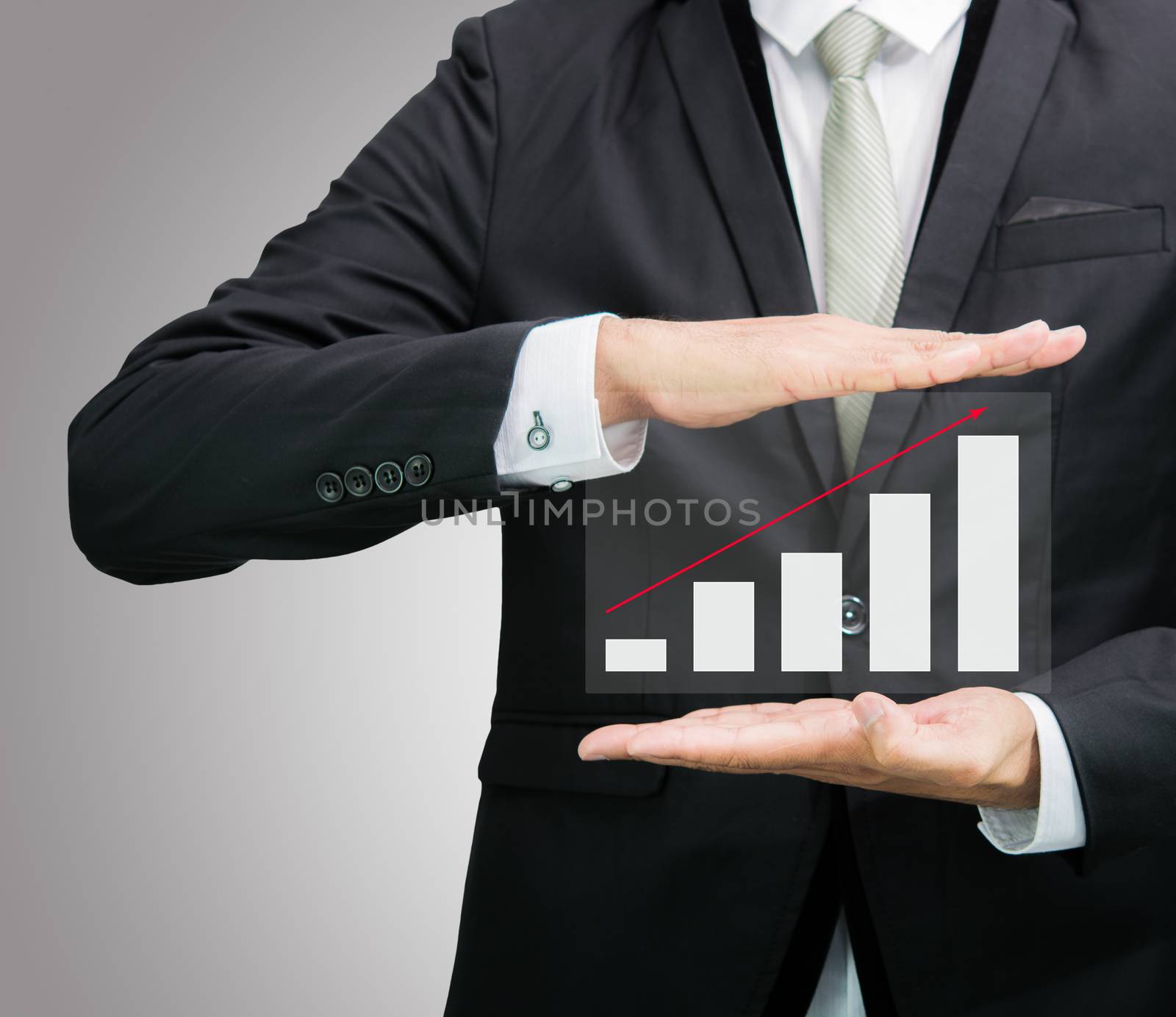 Businessman standing posture hand holding graph finance isolated by Sorapop